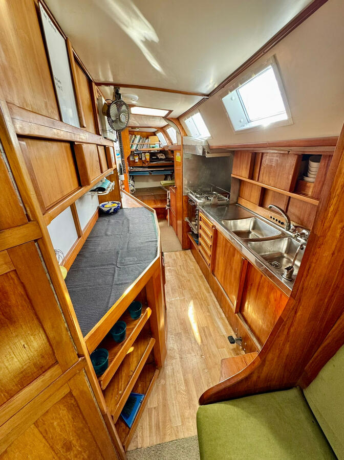 Looking aft from saloon through galley towards chart table Looking aft from saloon through galley towards chart table
