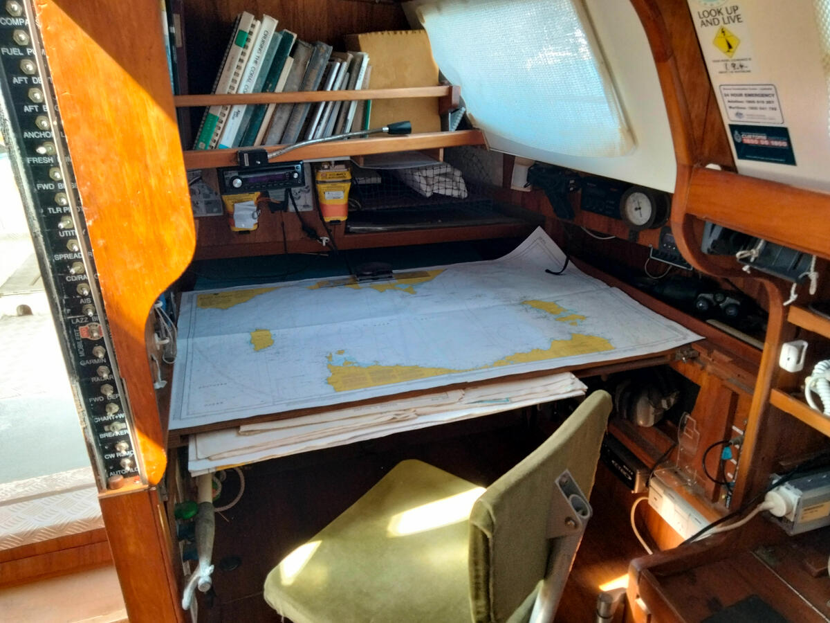 Sliding full size chart table above port quarterberth